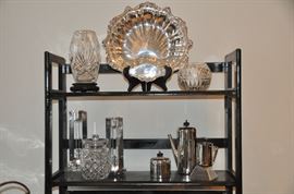 Amazing and rare Richard Meier for Swid Powell geometric 9” candlesticks (2nd shelf) as well as vintage cut crystal and Poole silver-plate. 