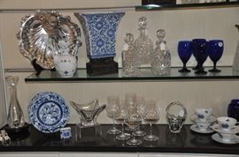 Wonderfil collection of home decor including Mainland-Smith porcelain vase  & carved iron base, a Royal Copenhagen  antique coffee/tea pot, a large antique silver-plate shell dish, cut crystal decanters and more. 