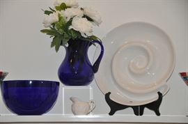 Fantastic heavy cobalt blue pitcher and bowl shown with a large white swirl serving piece. 