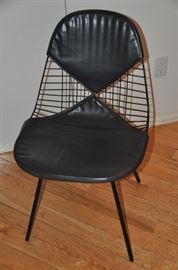 Fabulous authentic Herman Miller Eames mid-century black bikini chair. 
