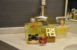 Large Fatice/Display Bottles of Hermès 24,  Fauberg, and Lancôme Poeme, as well as opera glasses in brocade case, and “Love” Ahava gold paperweight in Hebrew  