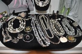 Silver tone, sterling and grey beaded jewelry including pieces by Ben Amun, Chico’s, Aloria and Terlin. 