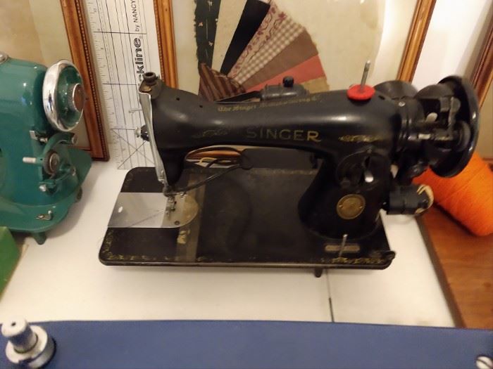 Vintage Singer sewing machine. Have tested and it works. We also have a gorgeous cabinet that it will fit in but we are not positive they originally went together.