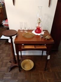 Vintage sewing cabinet in great condition. One of several oil lamps.