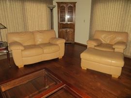 Leather living room furniture, corner cabinet, end tables and lamps.