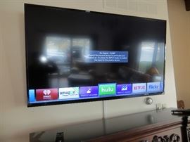 65" Vizio mounted TV.