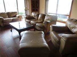 Leather living room furniture (sofa, love seat, chair and ottoman), corner cabinet, end tables, coffee table, and lamps.