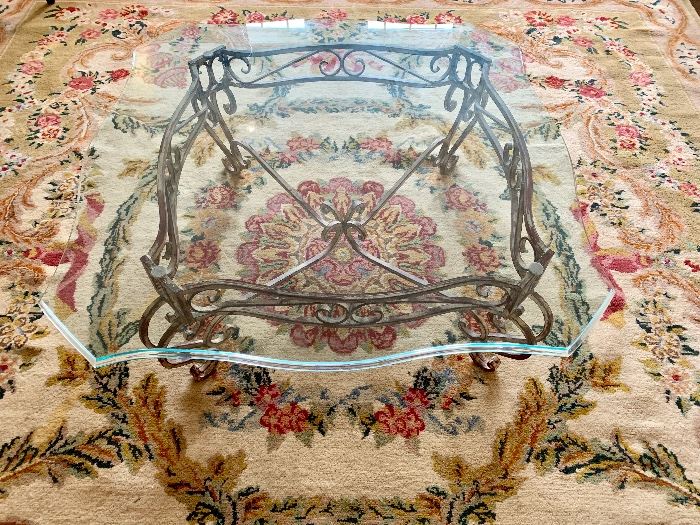 Glass top iron base table.