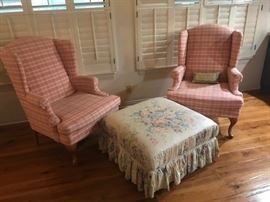 pair of pink wing back chairs