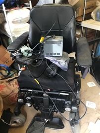 Handicap equipment including a $3000.00 M300 Permobil leather motorized wheelchair,