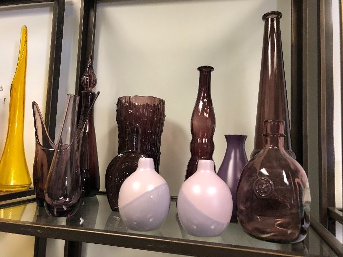 Purple glassware vases, bottles