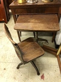 Vintage wooden school desk with connected chair