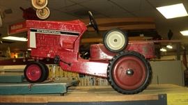 Antique Pedal Tractor ...comes with wagon that is upside down in this picture....sorry!