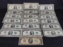 #515: 3 Blue Seal Dollar Bills, 15 Two Dollar Bills and a 10 Dollar Bill
3 Blue Seal Dollar Bills, 15 Two Dollar Bills and a 10 Dollar Bill