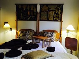 Vintage/antique twin headboards with decorative art, pillows