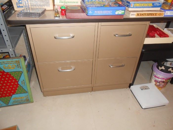 The file cabinet are attached to a table top