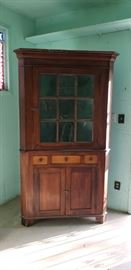 Antique corner cabinet.