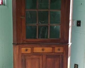 Antique corner cabinet.