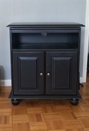 Wheeled, swivel top, TV stand.  Black.  Excellent condition.  Dimensions: 28 x 17 x 32.