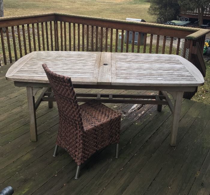 Teak outdoor table.  Good condition.  Dimensions: 78 x 30.  Extendable to 118 inches.  Rattan indoor and outdoor chairs.