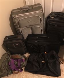 Various luggage and tote bags.