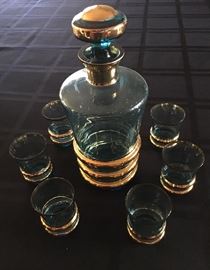 Vintage Bohemian (Slovakian) crystal decanter and glasses.  Rare cobalt with gold trim.  A great gift.