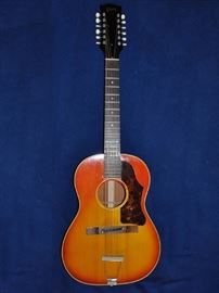 1967 Gibson B-25-12, 12-string acoustic guitar with original hard shell case.  Finish: Cherry sunburst.  Mahogany body and neck, rosewood fingerboard, spruce top.  Original owner.  Very good condition.