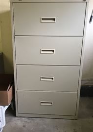 Steel four-drawer, double wide file cabinet.  Adjustable to hold both letter and legal size files.