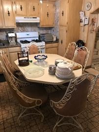 Mid-century Formica and wrought iron Kitchen Table and 6 swivel chairs 58 x 42
