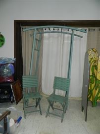 Metal Arbor, two wooden folding chairs