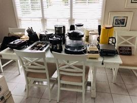 Large white farmhouse style kitchen/dining set with 6 matching chairs