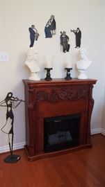 Nice Fake Fireplace--note the pretty violinist object d'art to the left