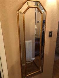 Bevealed mirror with gold accents