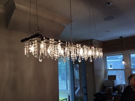 Artist made iron pipe chandelier with antique crystals $1000