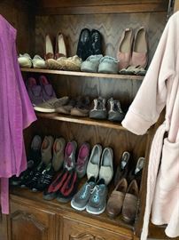 Many pairs of ladies designer shoes and boots, gently used.