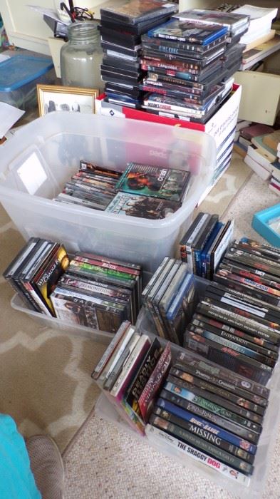 4 shoe totes, the big white storage tote, the big box next to the white one that's full and stacked on top and there's even more DVD's.  A big assortment of movies.  We also have CD's (but not this many)