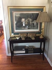 Black console table. Beautiful lamps and art.