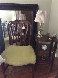 Antique chairs and beautiful, decorative mirror