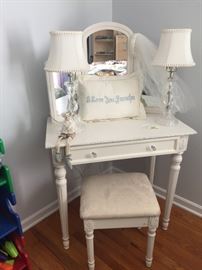 Adorable vanity with mirror and stool. 