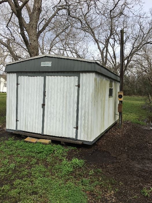 Storage shed with electric, AC and windows
Aluminum outside and wood inside.
Really good condition. 
Measures approximately 90” tall inside 10’ wide x 15’ long.
You must be able to take apart and / or move yourself.
Pick up is in Bay City.