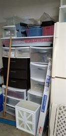 Lots of plastic storage bins of all sizes and shapes