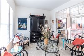 Chairs, coffee table, media cabinet, art