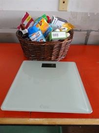 Basket with bathroom medicine items and a weighin ...