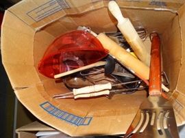 Kitchen utinsels and glass baking pans.