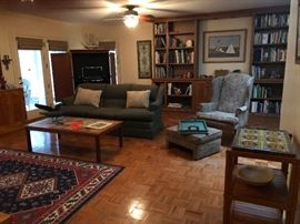 Books! Sofa, armchair, tile top side table, coffee table and area rug. Room to go!