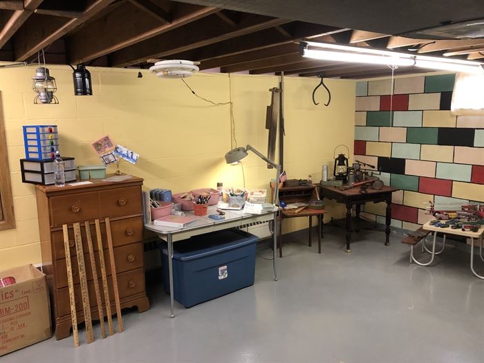 Here's the basement.....1950's Dining Table, Yard Sticks, Antique Items hang from the ceiling, Crafting Items.....Fun Treasures in the basement !
