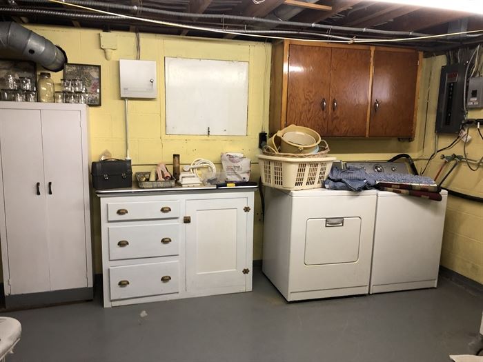 Center item is the base to the "upper cabinet" piece....Laundry baskets, Ironing Boards, Throw Rugs, Vintage Coveralls, Another Vintage Storage Cabinet....