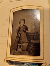 Vintage photo little girl with a gun rifle