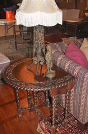 Carved Drop-Leaf Table with Statuary and Lamp
