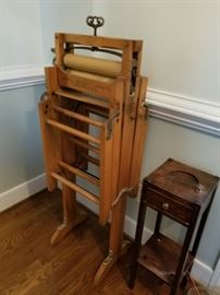 antique roller press and vintage smoking stand